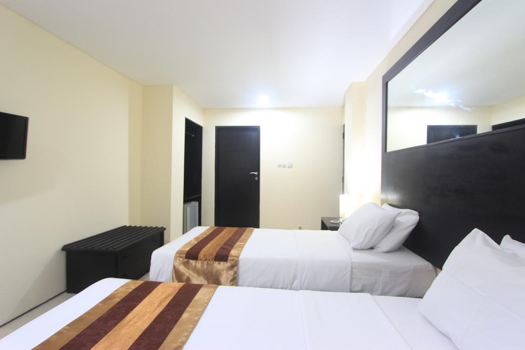 Airport Kuta Hotel And Residences Tuban Chambre photo